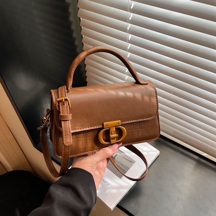 Damen elegante Handtasche mit strukturierter Oberfläche und glänzendem Verschluss Nord Taschen