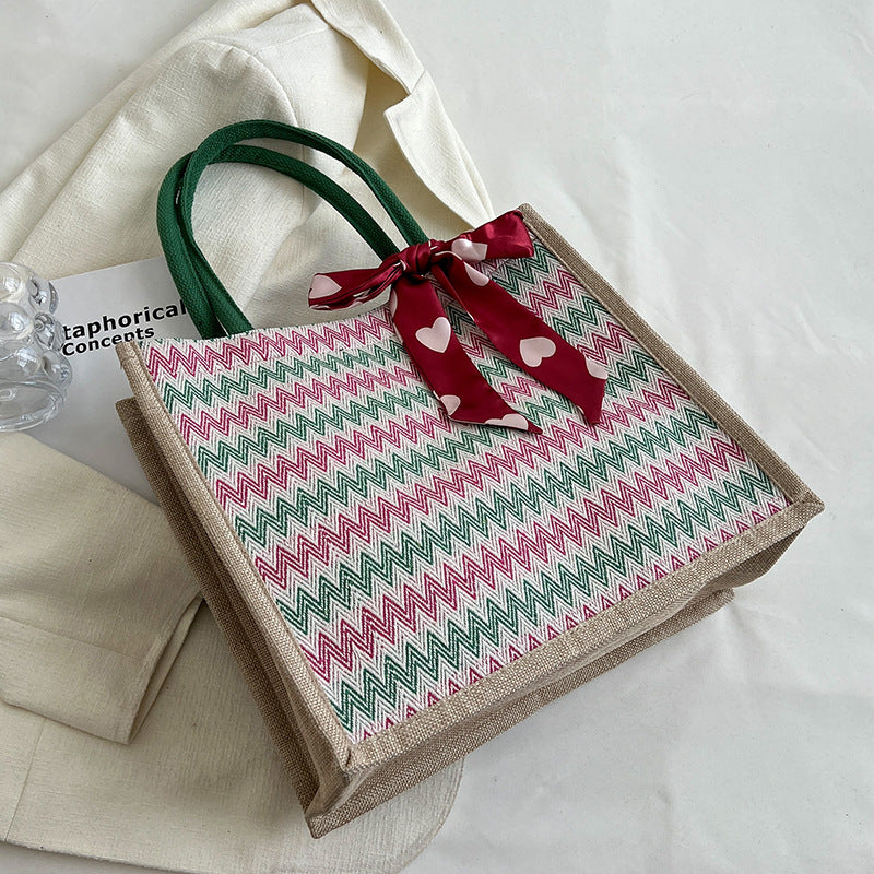 Damen Jute-Shopper mit modernem Wellenmuster und dekorativem Schleifenakzent Nord Taschen