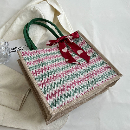 Damen Jute-Shopper mit modernem Wellenmuster und dekorativem Schleifenakzent Nord Taschen