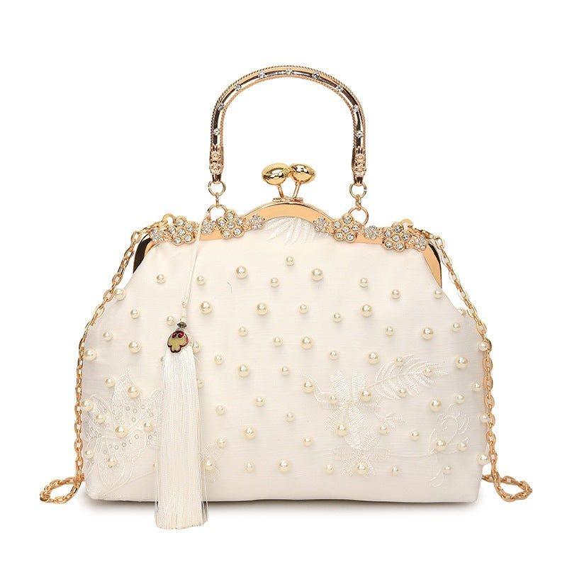 Damen elegante Handtasche mit perlenverziertem Design und Metallakzenten Nord Taschen