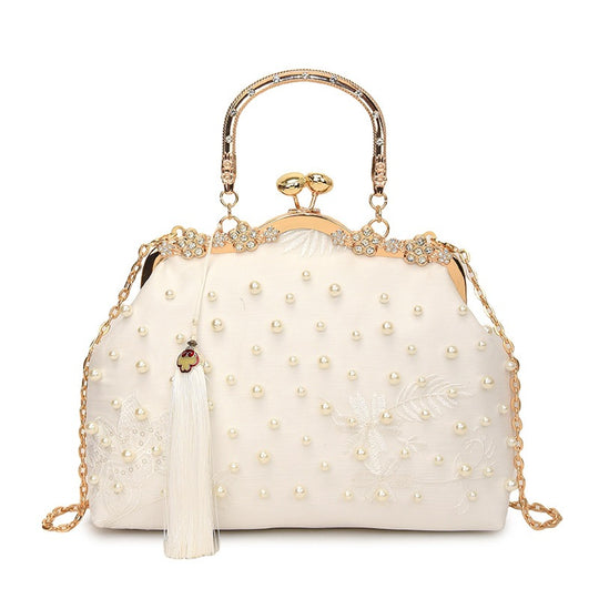 Damen elegante Handtasche mit perlenverziertem Design und Metallakzenten Nord Taschen