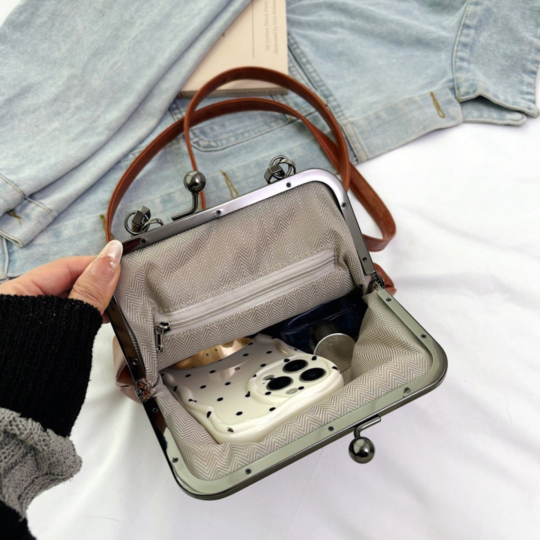 Damen elegante Handtasche mit robustem Metallverschluss Nord Taschen