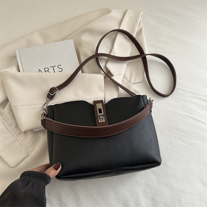 Damen elegante Umhängetasche mit hochwertiger Lederstruktur und modischem Verschluss Nord Taschen