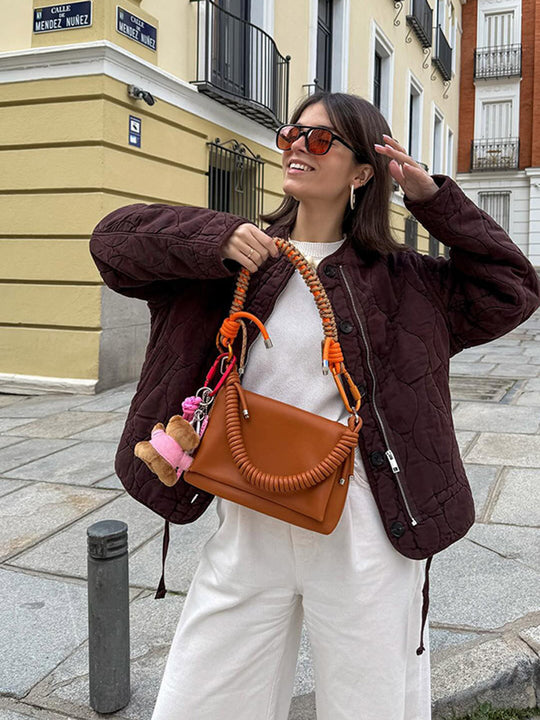 Damen Schultertasche aus Kunstleder mit geflochtenem Henkel und spiralförmigem Vordergriff Nord Taschen