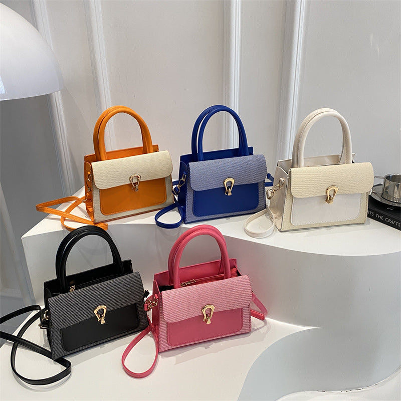 Damen elegante Umhängetasche mit strukturiertem Obermaterial und goldfarbener Verschlussmechanik Nord Taschen