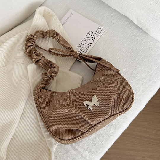 Damen Handtasche mit kreativer Faltentechnik und verspieltem Trageriemen Nord Taschen