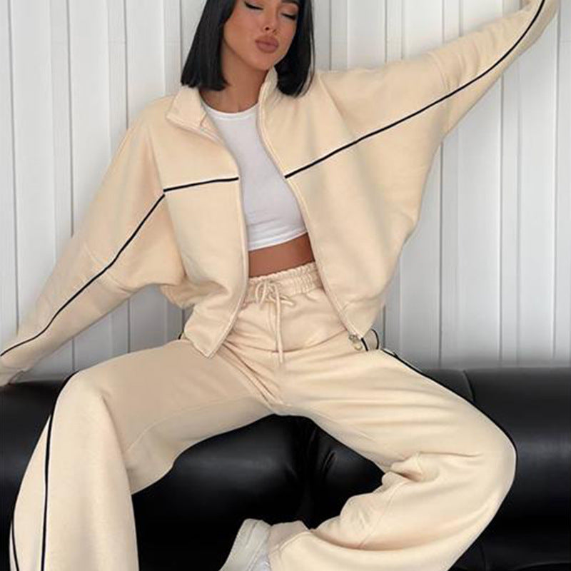 Damen lässiges Sweatset mit Stehkragen Reißverschluss gekürzter Jacke und hochtaillierter Schlaghose Nord Taschen