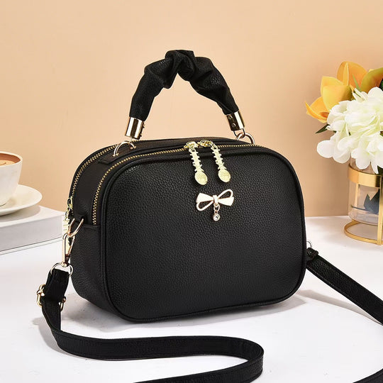 Damen Handtasche mit geflochtenem Tragegriff und edlem Zipper Nord Taschen