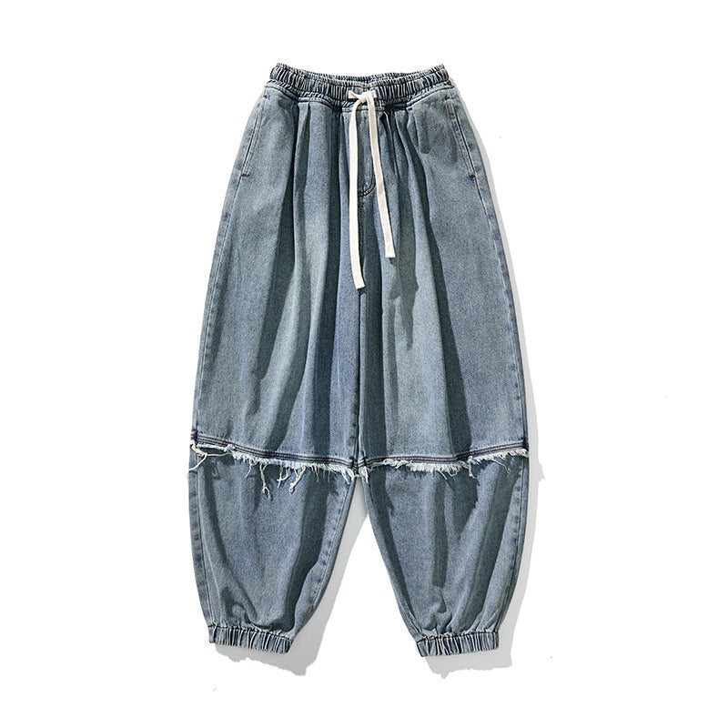 Herren Weit geschnittene Baggy-Denim-Hose mit Tunnelzug, elastischen Beinabschlüssen und Fransen-Detail Nord Taschen