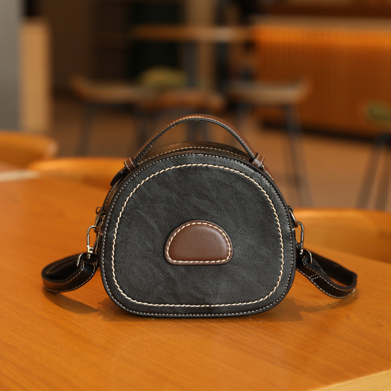 Damen Designer Handtasche mit modernem Rundschnitt und hochwertiger Lederverarbeitung Nord Taschen