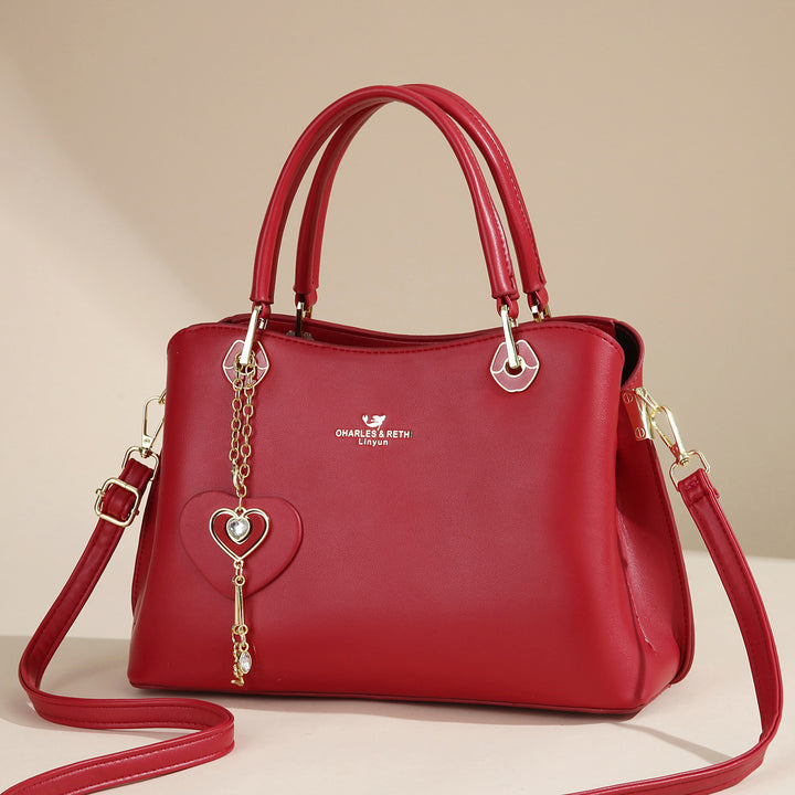 Damen elegante Handtasche mit Herzanhänger Nord Taschen