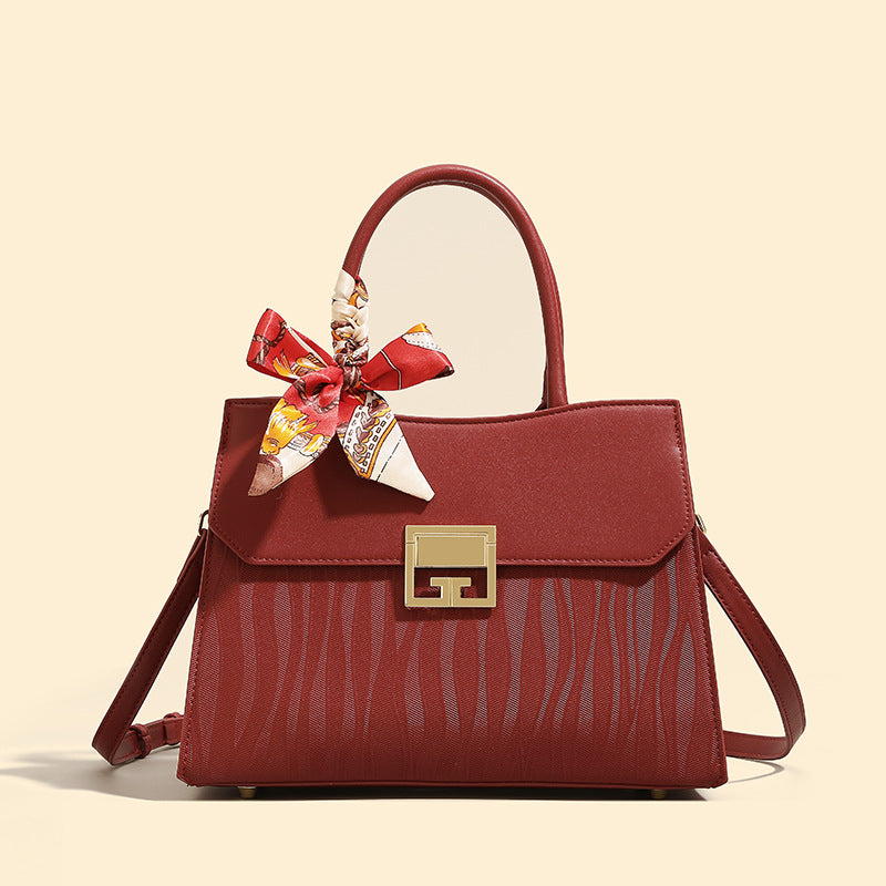 Damen Handtasche mit verstellbarem Schulterriemen und elegantem Schleifenakzent Nord Taschen