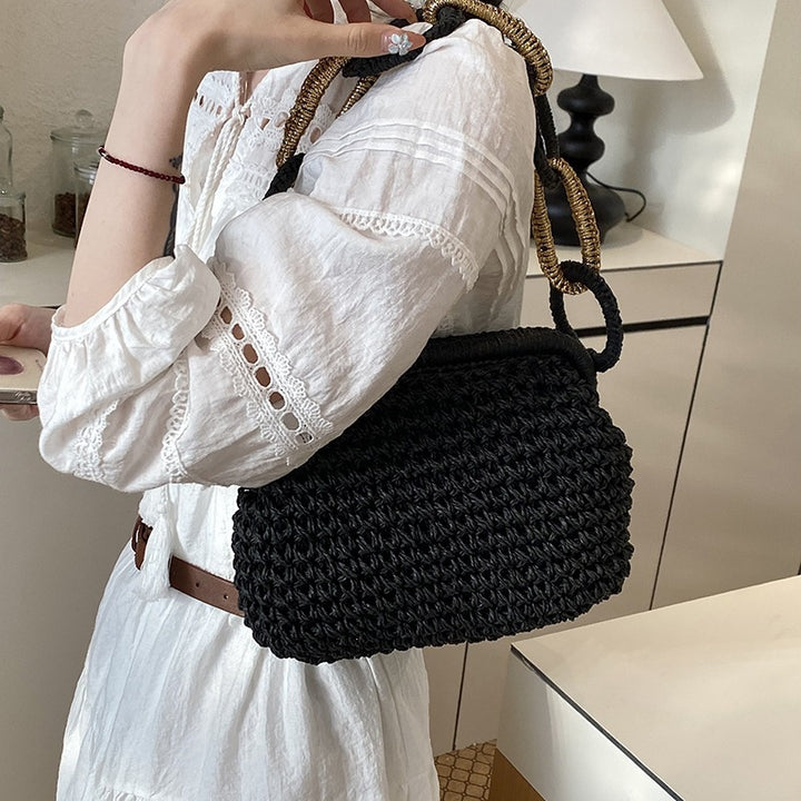 Damen-Handtasche aus geflochtenem Material mit dekorativen Griffen Nord Taschen