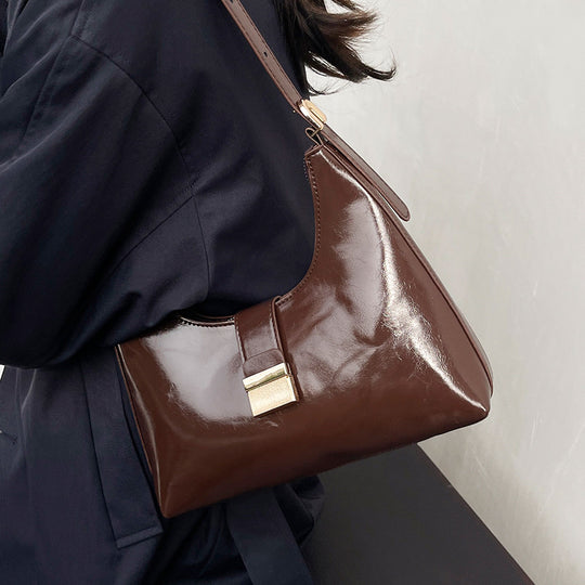 Damen elegante Handtasche mit glänzendem Obermaterial und innovativem Verschluss Nord Taschen