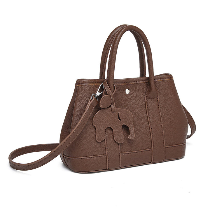 Damen Handtasche mit abnehmbarem Elefantenanhänger und elegantem Kunstleder Nord Taschen
