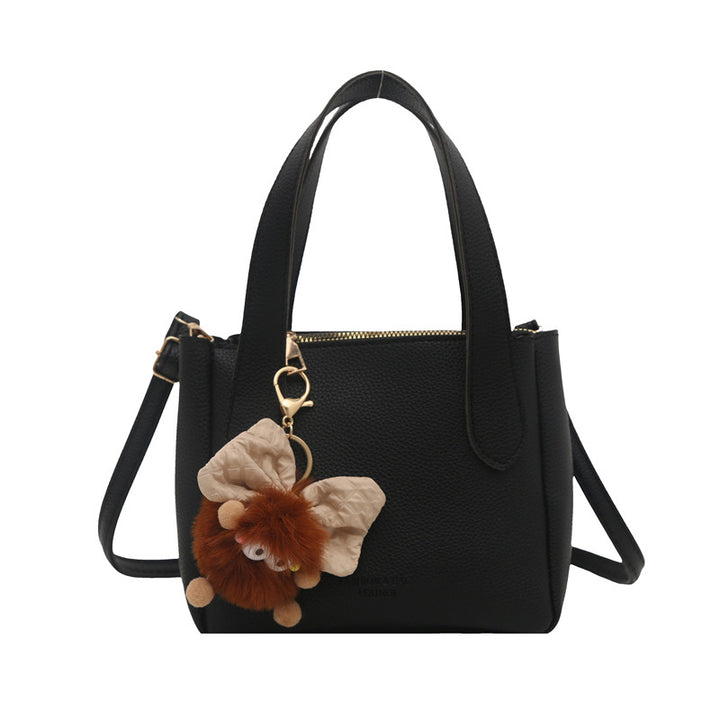 Damen elegante Handtasche mit flauschigem Anhänger Nord Taschen