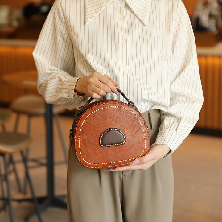 Damen Designer Handtasche mit modernem Rundschnitt und hochwertiger Lederverarbeitung Nord Taschen