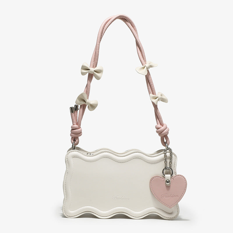Damen Mini-Handtasche mit kreativem Wellenmuster und verspieltem Anhänger Nord Taschen