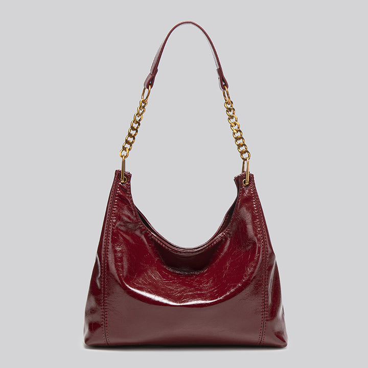 Damen Hobo-Tasche mit glänzender Oberfläche und dekorativem Kettenhenkel Nord Taschen