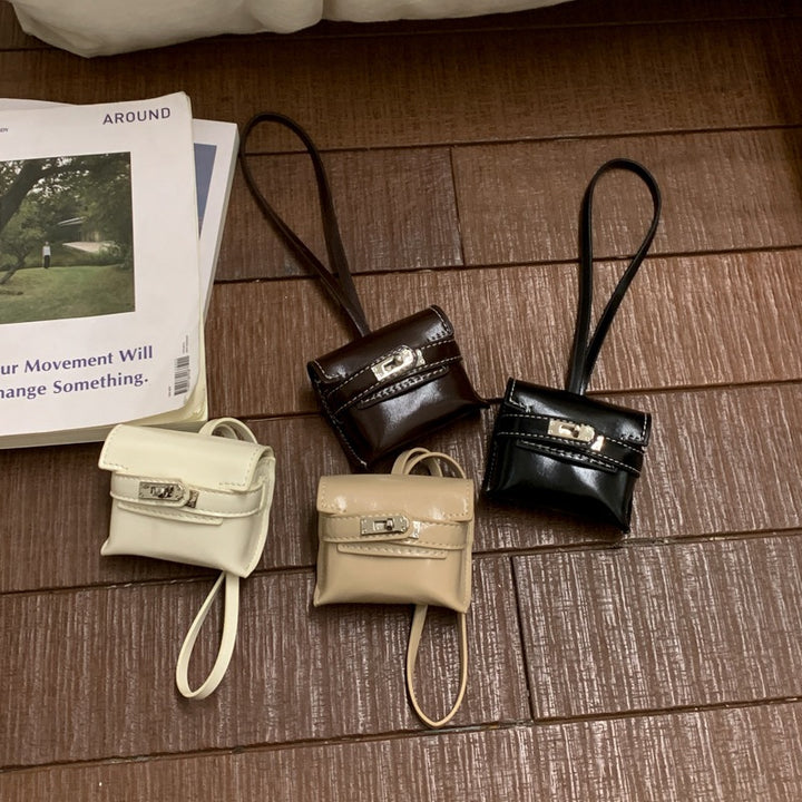 Damen Mini-Handtasche aus hochwertigem Kunstleder mit verspieltem Verschluss Nord Taschen