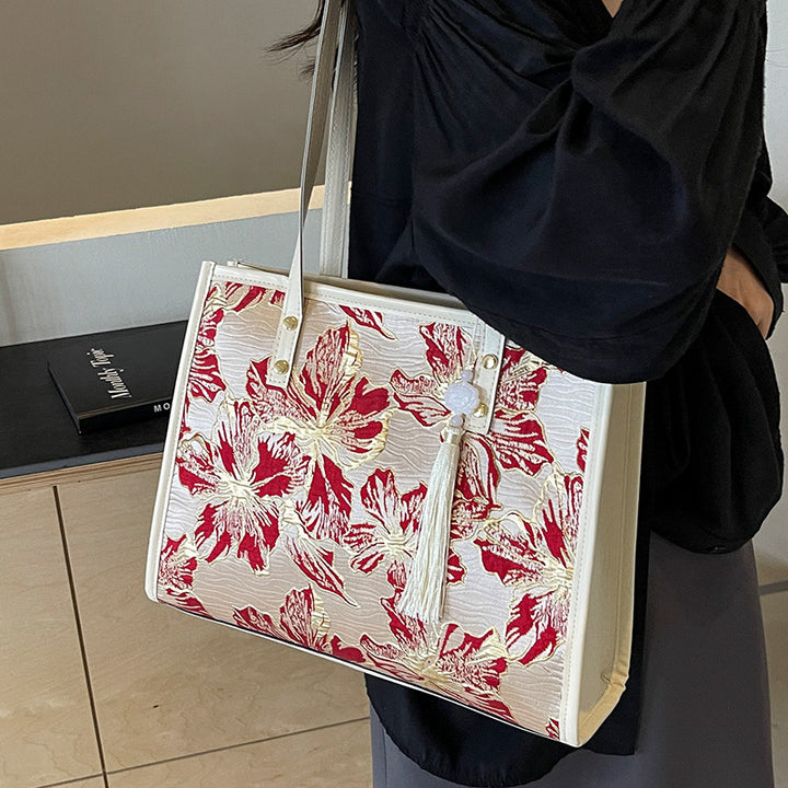 Damen Tragetasche mit floralem Stickdesign und elegantem Quastenanhänger Nord Taschen