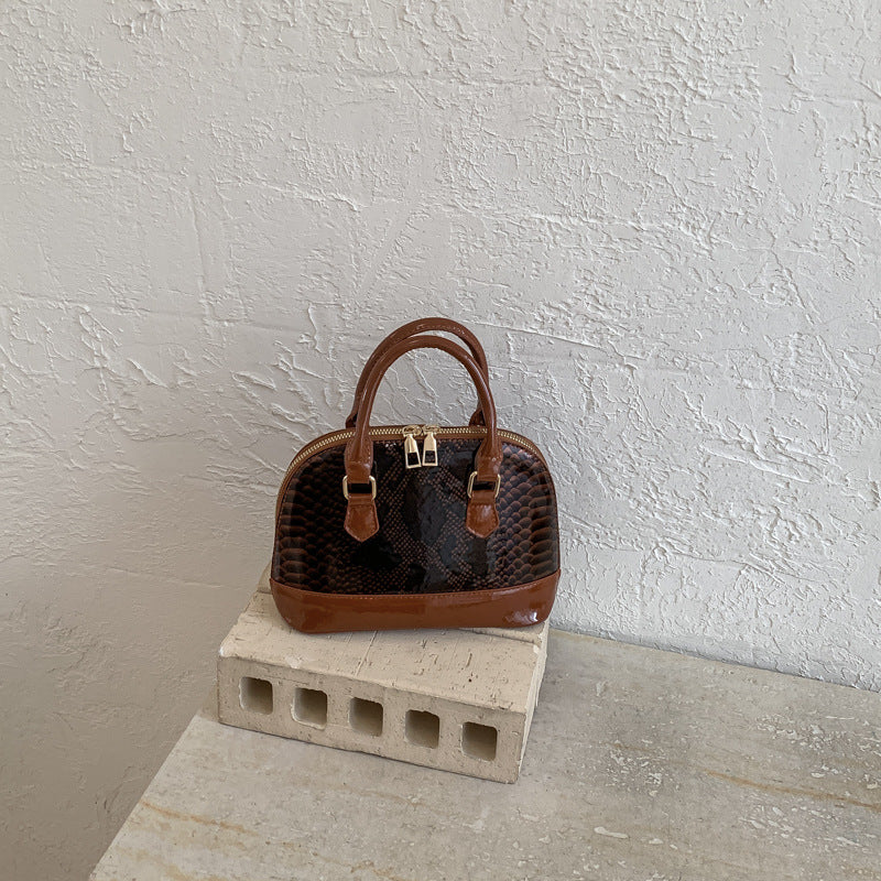 Damen elegante Handtasche im stilvollen Schlangenleder-Look Nord Taschen