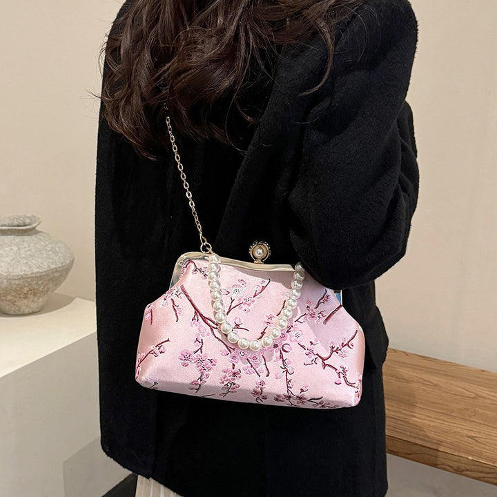 Damen elegante Clutch mit floralen Akzenten Nord Taschen