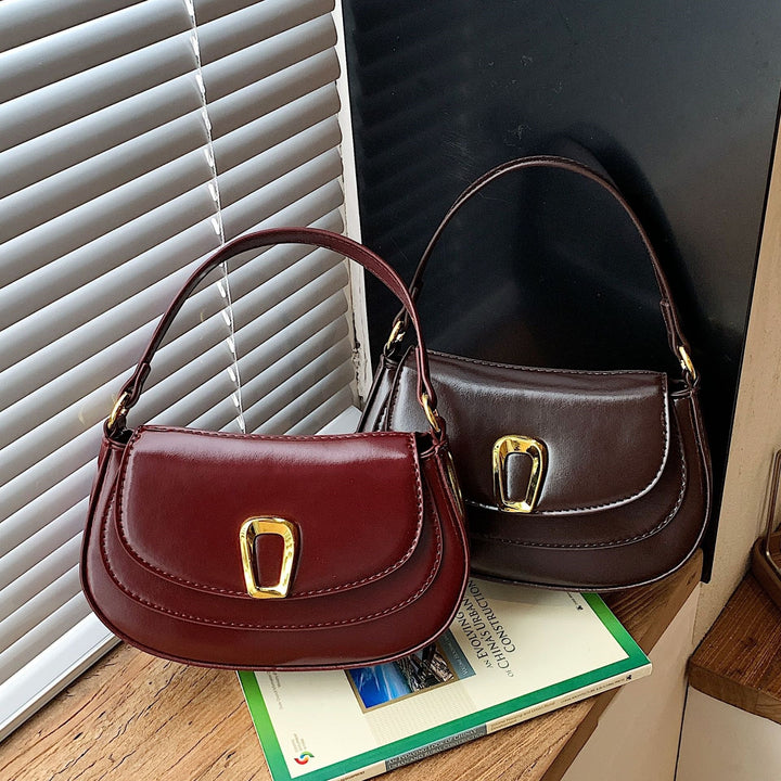 Damen Schultertasche mit elegantem Kettenverschluss und modischer Form Nord Taschen