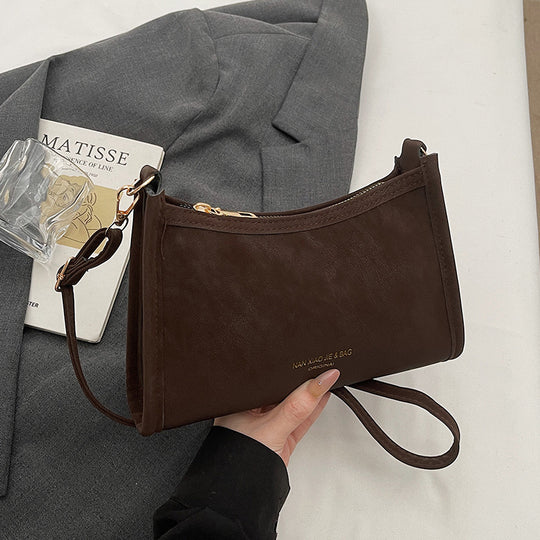 Damen Umhängetasche aus hochwertigem Kunstleder mit elegantem Reißverschluss Nord Taschen