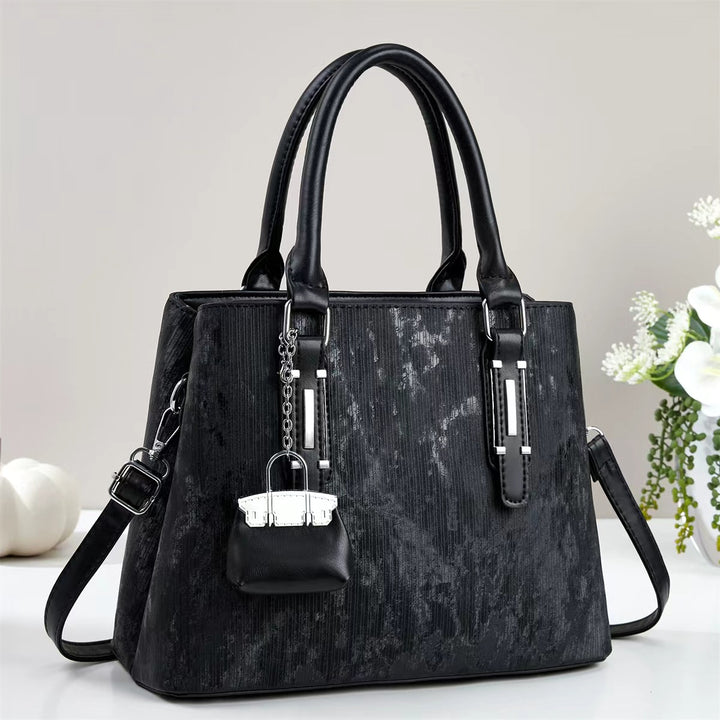 Damen elegante Handtasche mit dekorativem Schlüsselanhänger Nord Taschen
