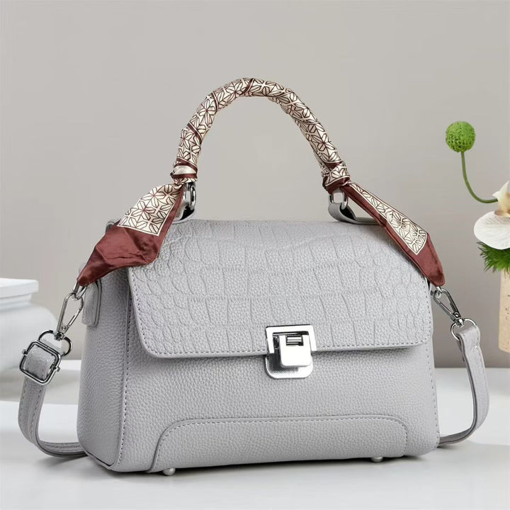 Damen elegante Handtasche mit abnehmbarem Tragegurt und dekorativem Schal Nord Taschen