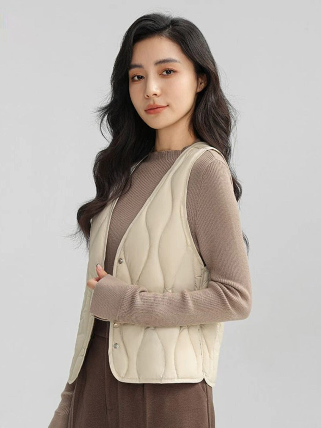 Damen Lange gesteppte Thermoweste mit ergonomischer Wellensteppung Nord Taschen