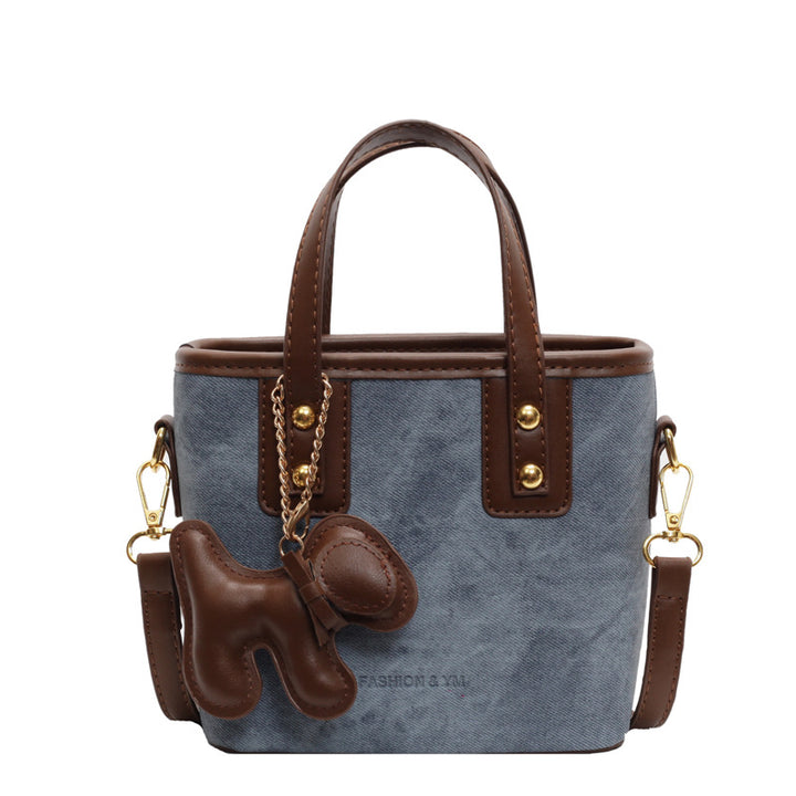 Damen Mini-Tasche aus hochwertigem Material mit abnehmbarem Witz-Anhänger | Nord Taschen