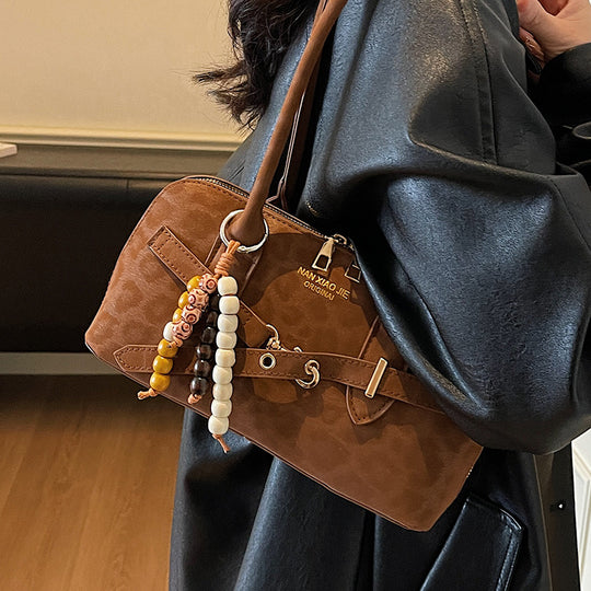 Damen Umhängetasche aus weichem Kunstleder mit kreativen Dekorelementen Nord Taschen