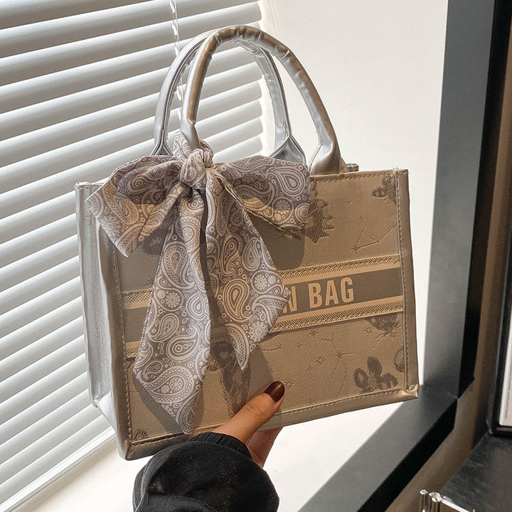 Damen Handtasche im eleganten Design mit dekorativem Schal Nord Taschen
