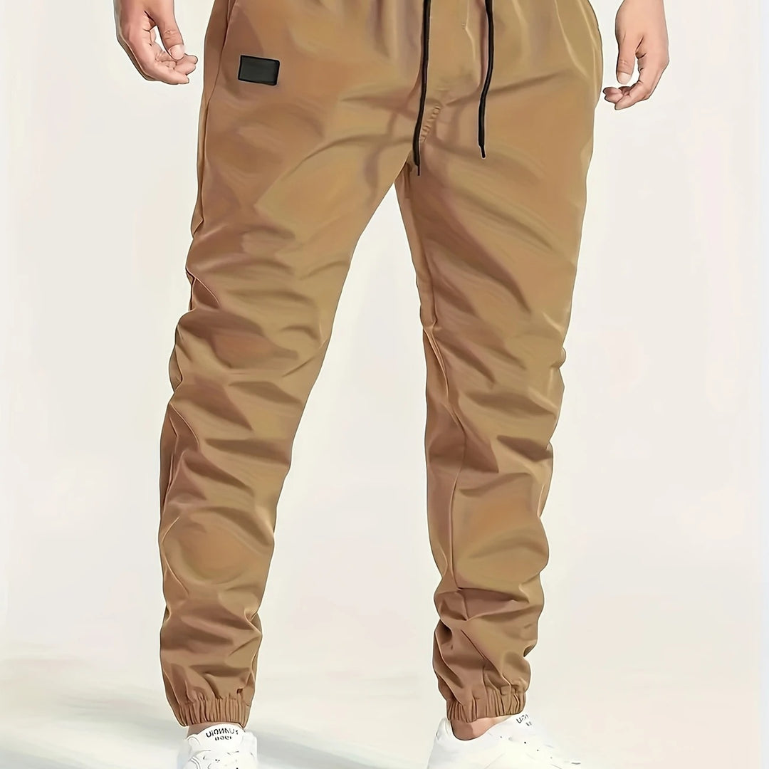 Herren Slim‑Tapered Tech‑Joggerhose mit Tunnelzugbund, elastischen Knöchelbündchen und funktionalen Seitentaschen Nord Taschen