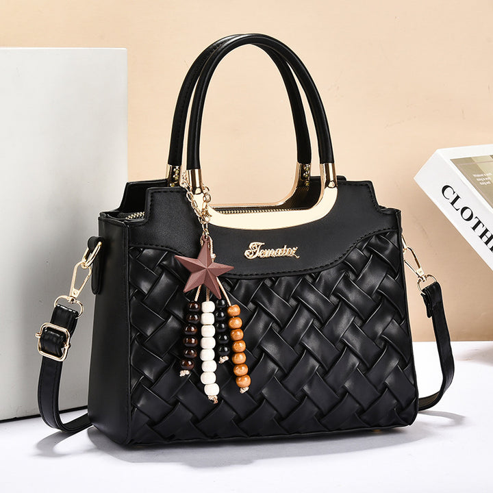 Damen elegante Handtasche mit kunstvollem Flechtmuster und abnehmbarer Quaste Nord Taschen