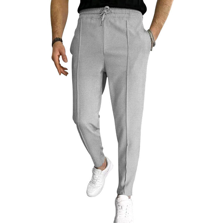 Herren nan schmal zulaufende Jogging-Chino aus strukturierter WNord Taschenqualität mit elastischem Tunnelzugbund und dekorativer Bügelfalte