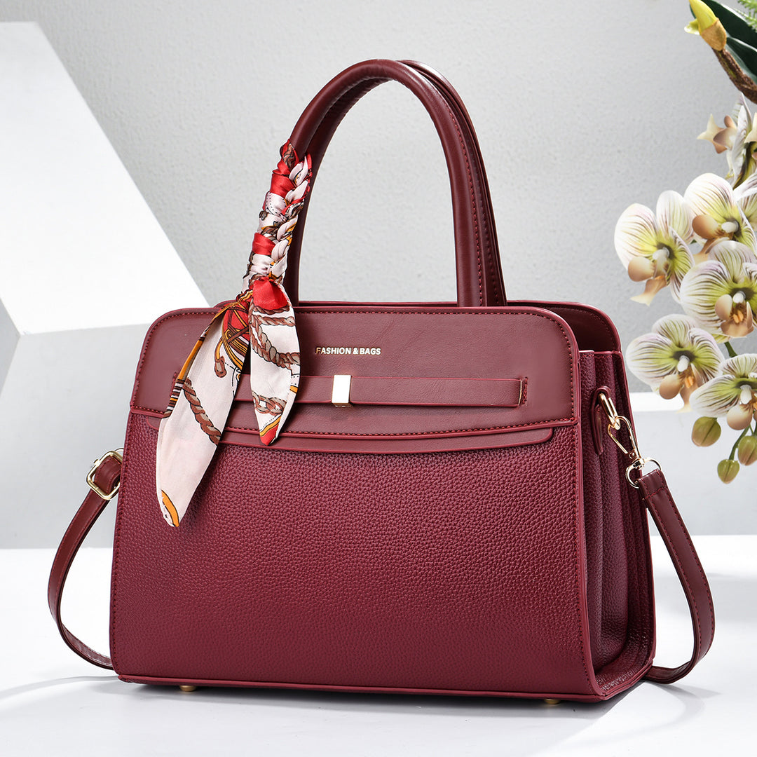 Damen elegante Handtasche mit praktischen Fächern und verspieltem Schal Nord Taschen