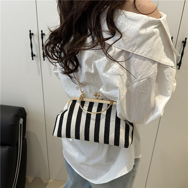 Damen Handtasche mit gestreiftem Design und goldenen Akzenten Nord Taschen
