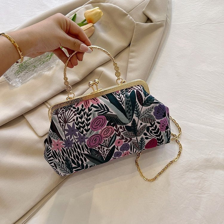 Damen Clutch-Tasche mit floralem Design und goldenen Akzenten Nord Taschen