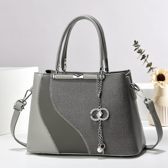 Damen Handtasche aus hochwertigem Kunstleder mit detailverliebtem Design und abnehmbarem Schulterriemen Nord Taschen