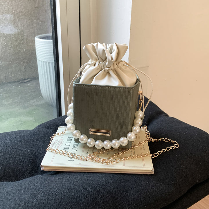 Damen stilvolle Mini-Handtasche mit Kordelzug und Perlenakzent Nord Taschen
