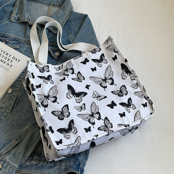 Damen Einkaufstasche mit floralem Schmetterlingsdesign und stabilen Tragegriffen Nord Taschen