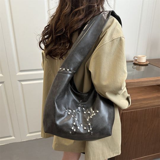 Damen Hobo-Tasche mit eleganter Sternenverzierung und strukturiertem Kunstleder Nord Taschen