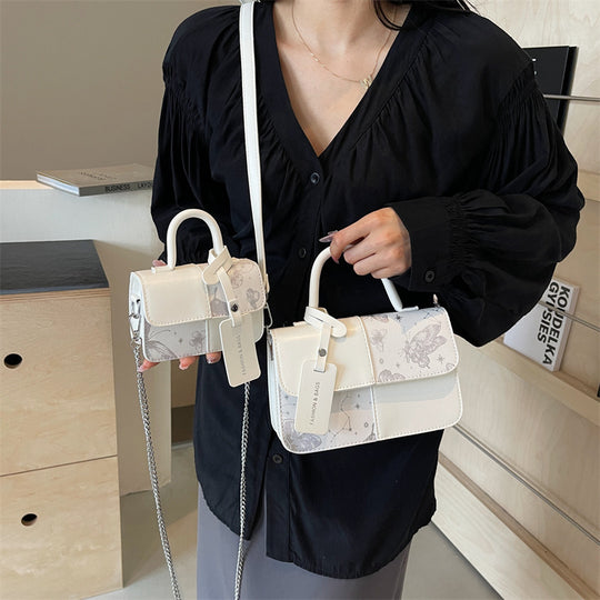 Damen elegante Umhängetasche mit floralem Design und modischen Akzenten Nord Taschen