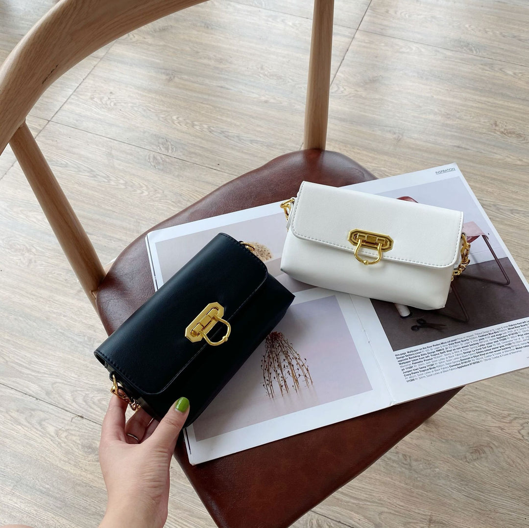 Damen Umhängetasche mit elegantem Kettenriemen und klappbarem Verschluss Nord Taschen