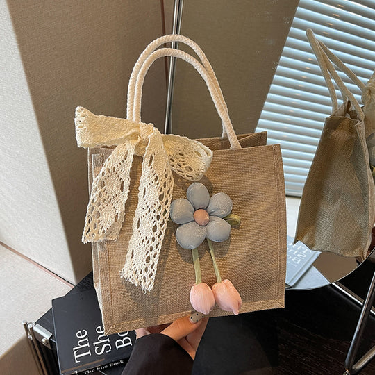 Damen Jute-Handtasche mit floralen Applikationen und dekorativem Schleifen-Design Nord Taschen
