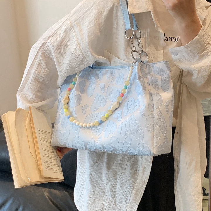 Damen modische Handtasche mit Herzprägung und buntem Anhänger Nord Taschen