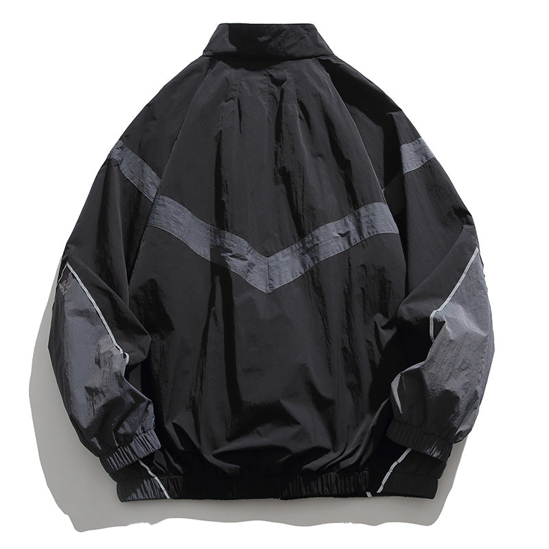 [Unisex] Oversize technische Wind- und Regenjacke mit Stehkragen, reflektierenden Paspeln und elastischem Saum Nord Taschen